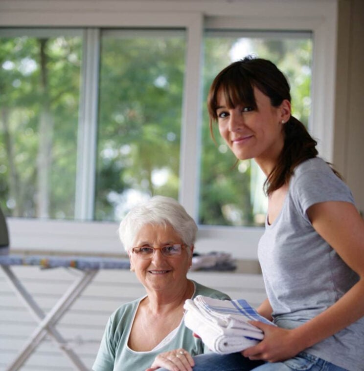 Young Woman and old lady smiling