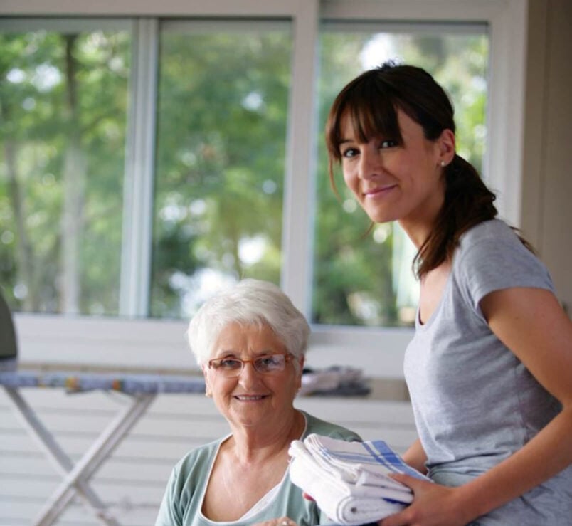 Young Woman and old lady smiling